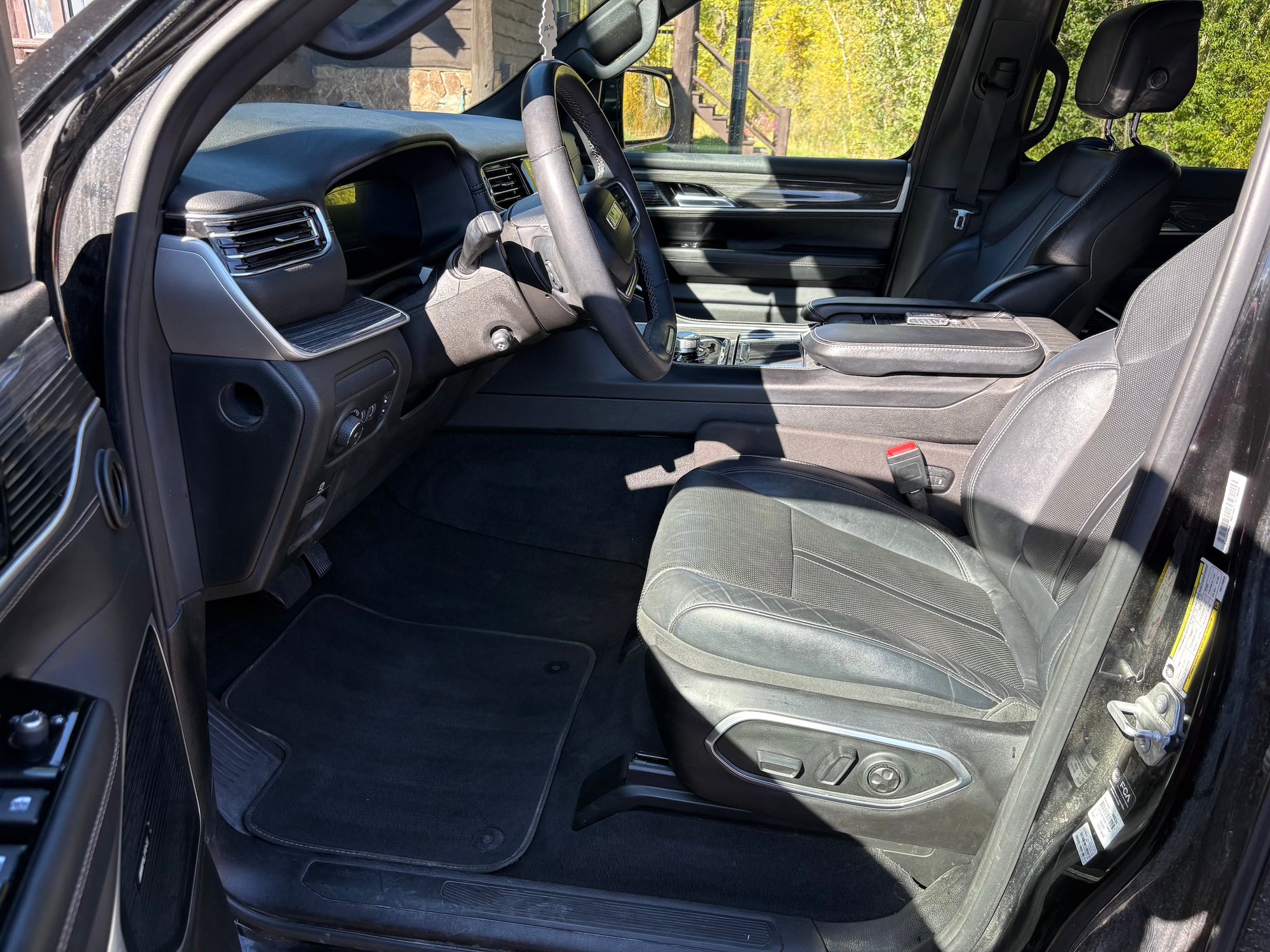 Car interior with steering wheel and dashboard view