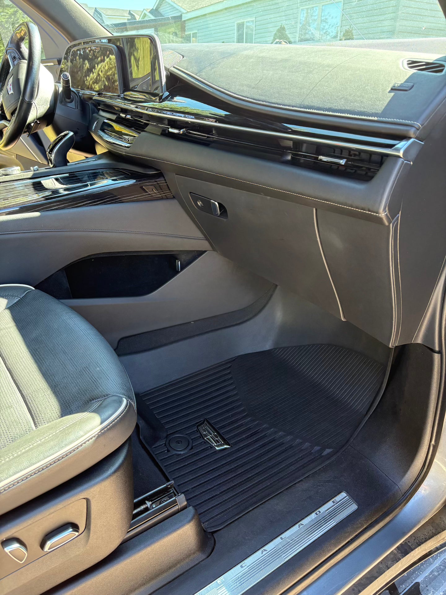 Car interior with a focus on the driver's seat and dashboard.