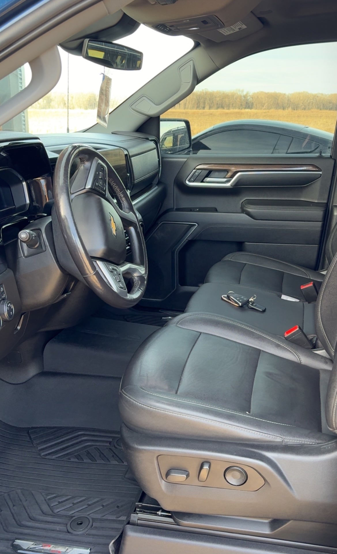 Car interior with steering wheel and dashboard view
